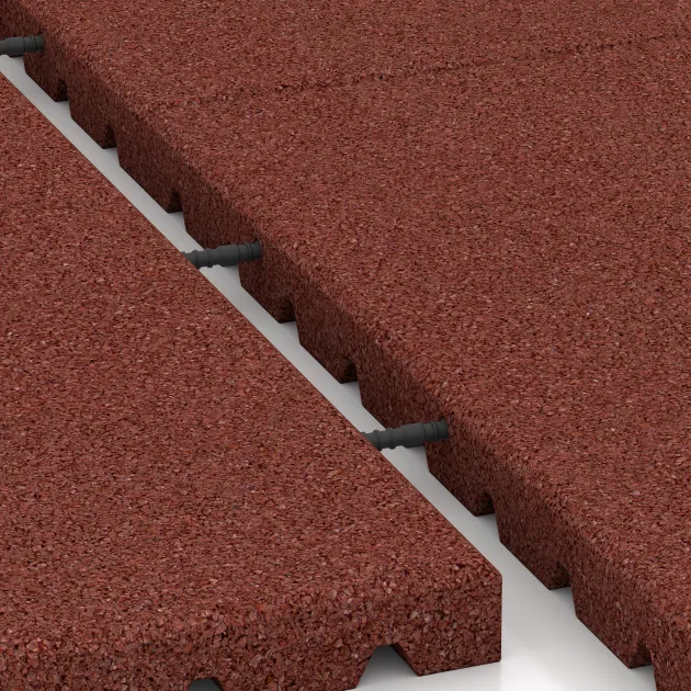 Großaufnahme vom Verbindungssystem von WARCO-Boden 5665 - Varovalna podloga igrišča 4 cm - EN 1177 ≤ 110 cm im Farbdesign Opečno rdeča. Abmessungen 1000 x 1000 x 40 mm.