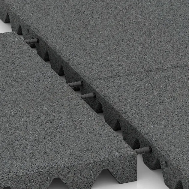 Großaufnahme vom Verbindungssystem von WARCO-Boden 5527 - Varnostna gumijasta plošča za otroška igrišča 4,5 cm - EN 1177 ≤ 140 cm im Farbdesign Lupkovosiva. Abmessungen 500 x 500 x 45 mm.