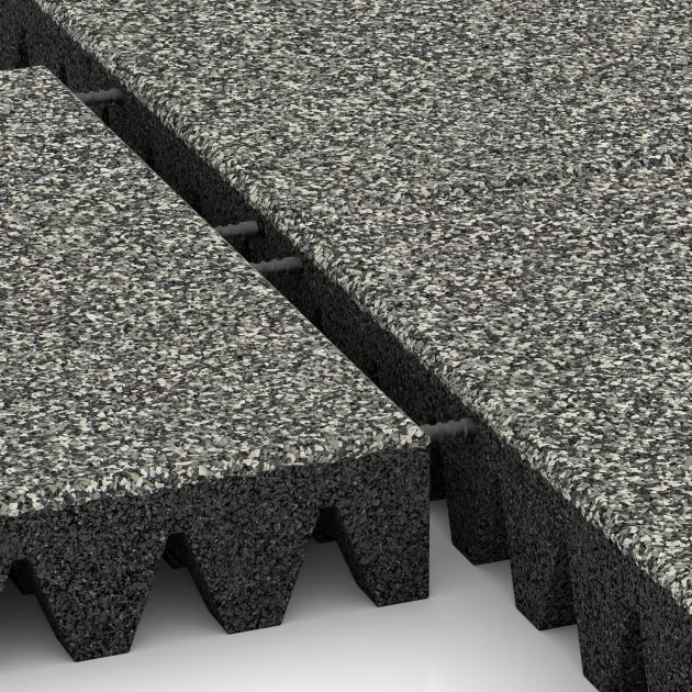 Großaufnahme vom Verbindungssystem von WARCO-Boden 5367 - Gumijasta varovalna plošča za otroška igrišča im Farbdesign Siv granit. Abmessungen 500 x 500 x 80 mm.