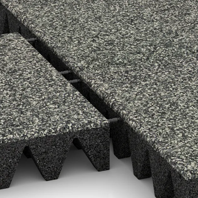 Großaufnahme vom Verbindungssystem von WARCO-Boden 5644 - Varnostna gumijasta plošča za otroška igrišča 10 cm - EN 1177 ≤ 300 cm im Farbdesign Siv granit. Abmessungen 500 x 500 x 100 mm.