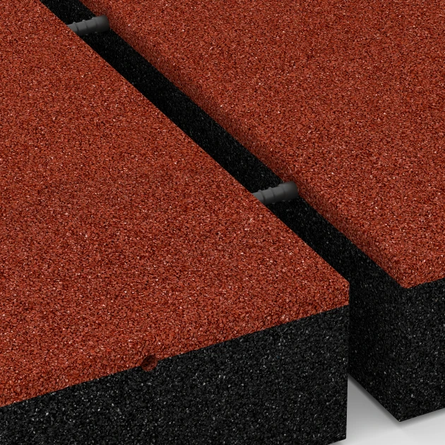 Großaufnahme vom Verbindungssystem von WARCO-Boden 6278 - Gumijasta varnostna plošča – 300 cm im Farbdesign Opečno rdeča. Abmessungen 50 x 50 x 11 cm.